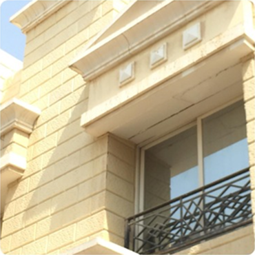 Exterior of a modern building featuring angular architecture and prominent wooden facade elements, possibly a commercial or residential structure.