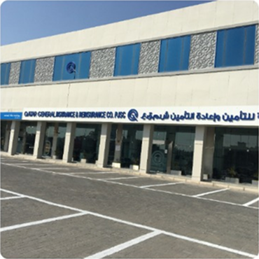 Exterior view of a modern, multi-story building, Qatar General Insurance branch
